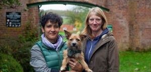 Dr Sylvia Travershead of horticulture, poses with team leader Jo Parr and Sylvia’s dog Florrie outside walled garden