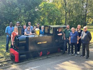 Volunteers gather to announce the new railway funding