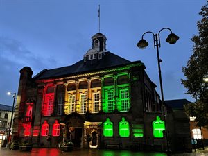 Leigh Town hall lit up in the Black History Month colours