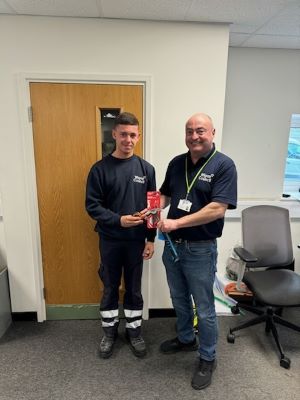 Callum alongside one of the Wigan and Leigh Building Services staff