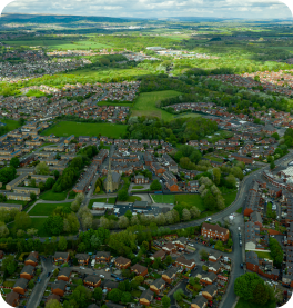 An image taken from a drone overlooking a town in the countryside